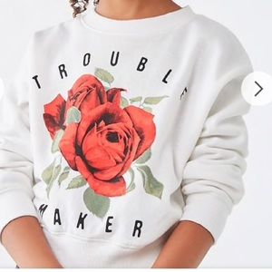 White sweater that say trouble maker